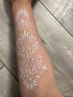 White henna-style arm painting by Maryam Fitzgerald — Flutter Face Paint