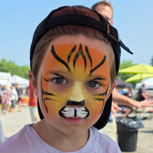 Tiger face paint by Maryam Fitzgerald, face painter in Ottawa