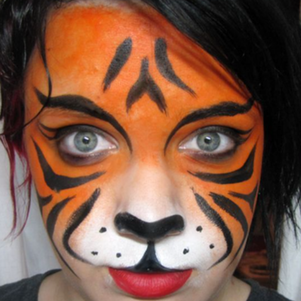 Tiger face paint by Maryam Fitzgerald, face painter in Ottawa